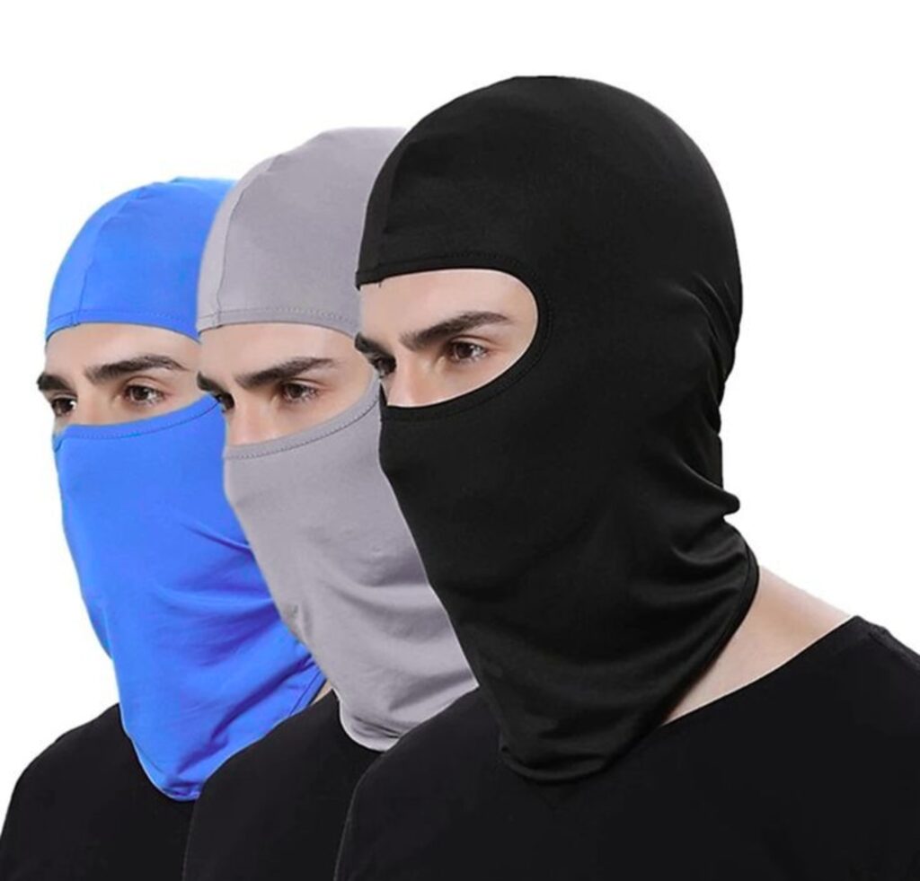 "Three balaclavas in black, gray, and blue worn by models, covering the head and face with openings for the eyes."