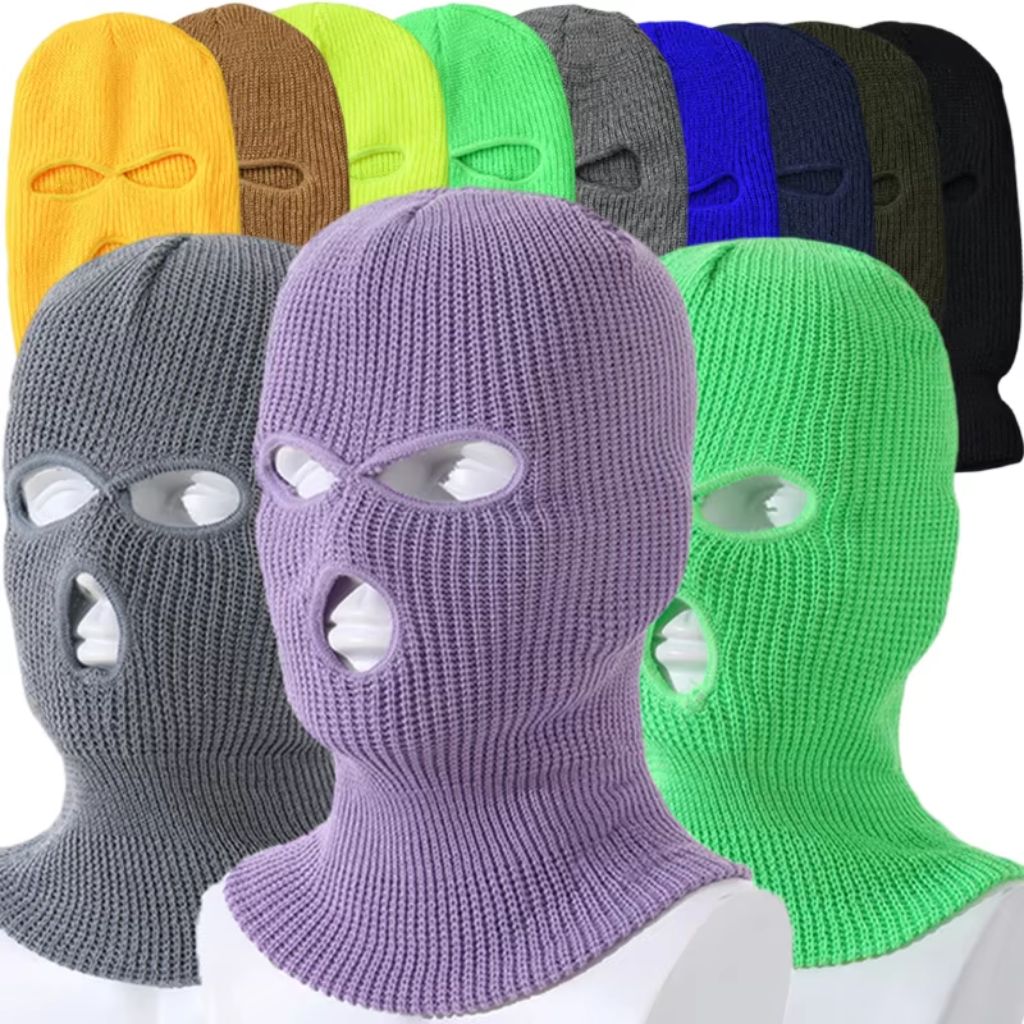 Colorful knitted balaclava ski masks in various shades including purple, gray, green, yellow, and black.