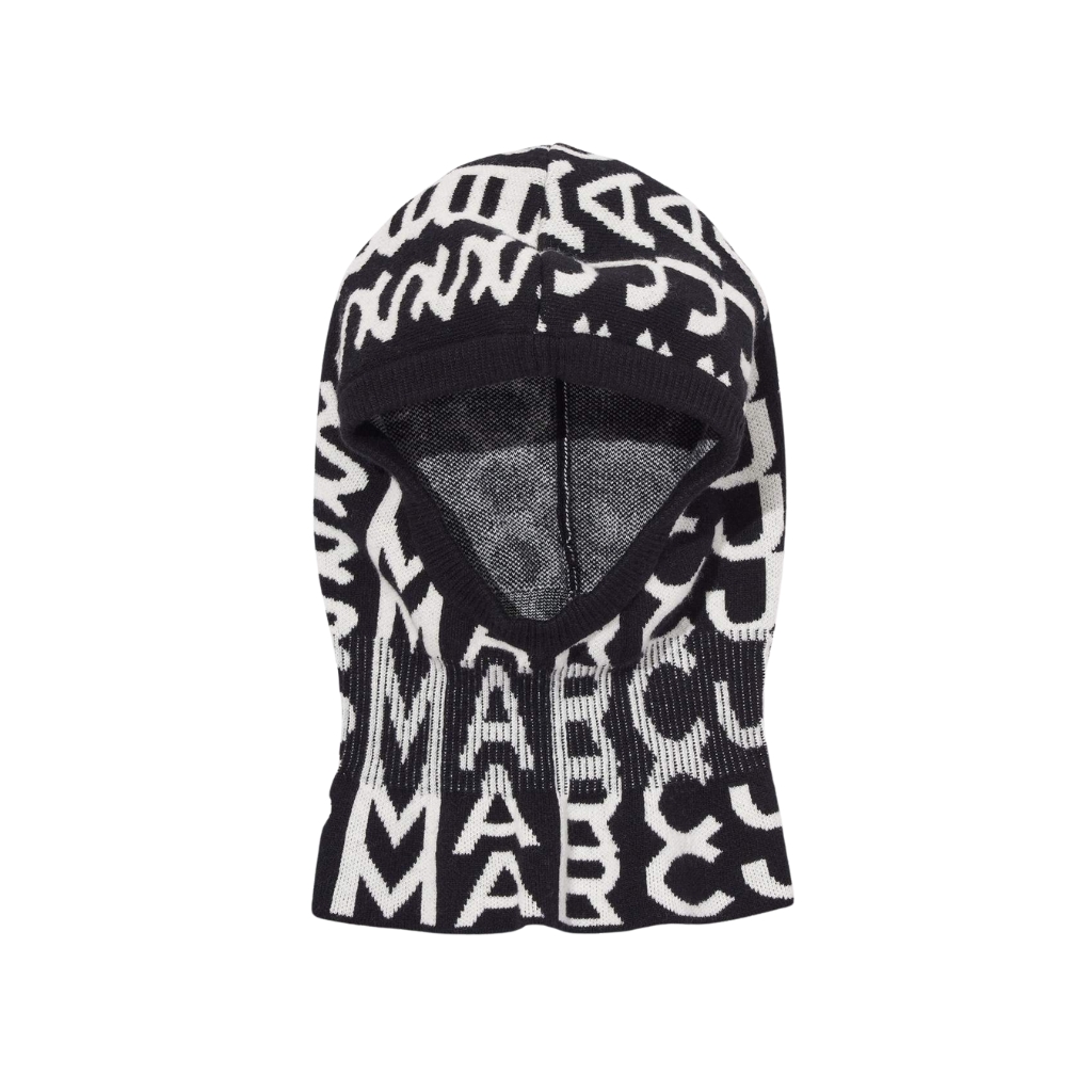 Black and white knit balaclava with abstract text pattern and a single eye opening.