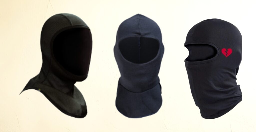 “Three balaclavas displayed side by side: leftmost is a black balaclava with a hooded top, middle is a dark navy blue balaclava with open face, and rightmost is a black balaclava with a small red broken-heart emblem on the side.”