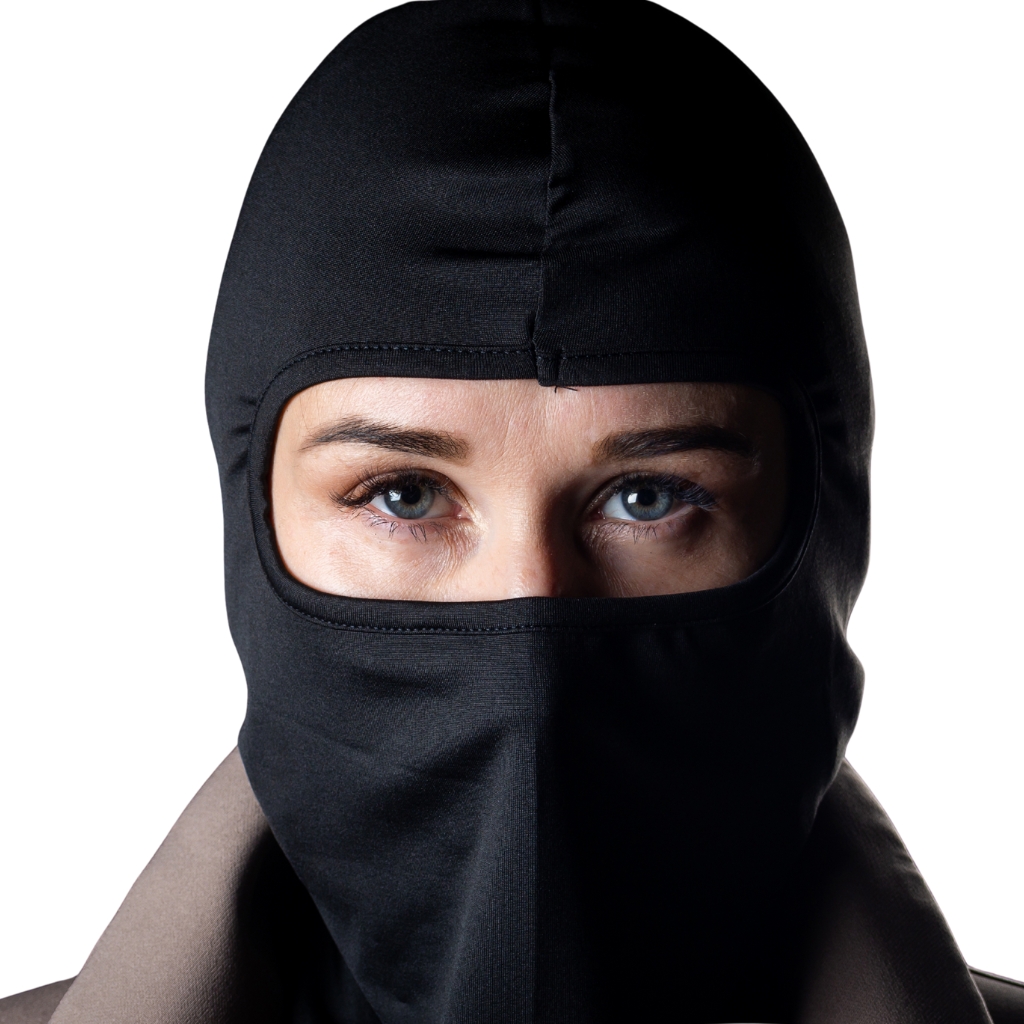 A close-up portrait of a person wearing a black balaclava that covers most of the head, leaving only the eyes visible.