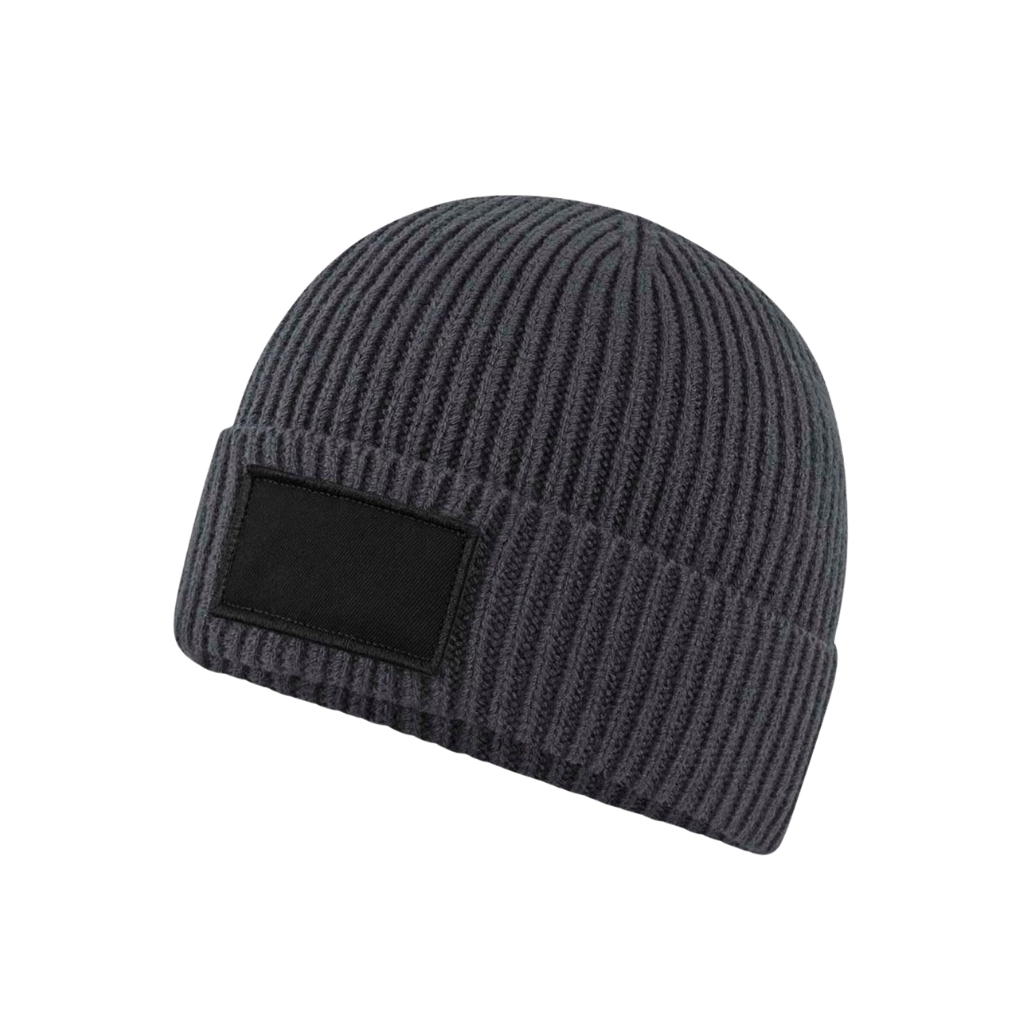 Dark gray ribbed knit beanie with a folded cuff and a blank rectangular patch on the front.