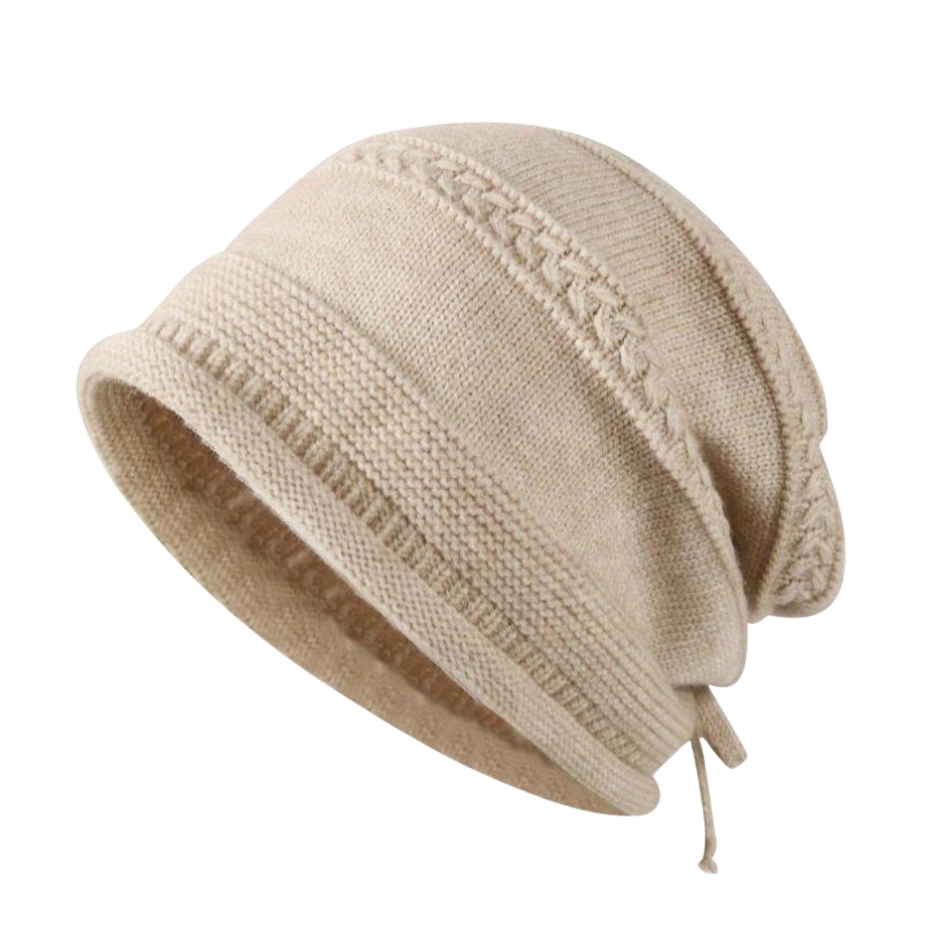 Beige knit drawstring beanie with a tapered shape and adjustable drawstrings at the opening