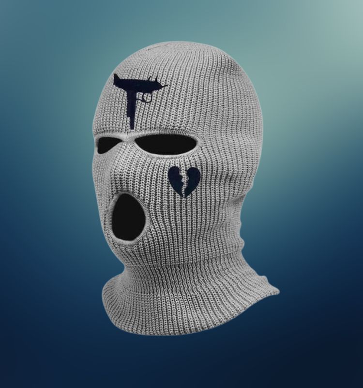 Gray knitted adult balaclava ski mask with gun and broken heart embroidery, featuring three-hole design.