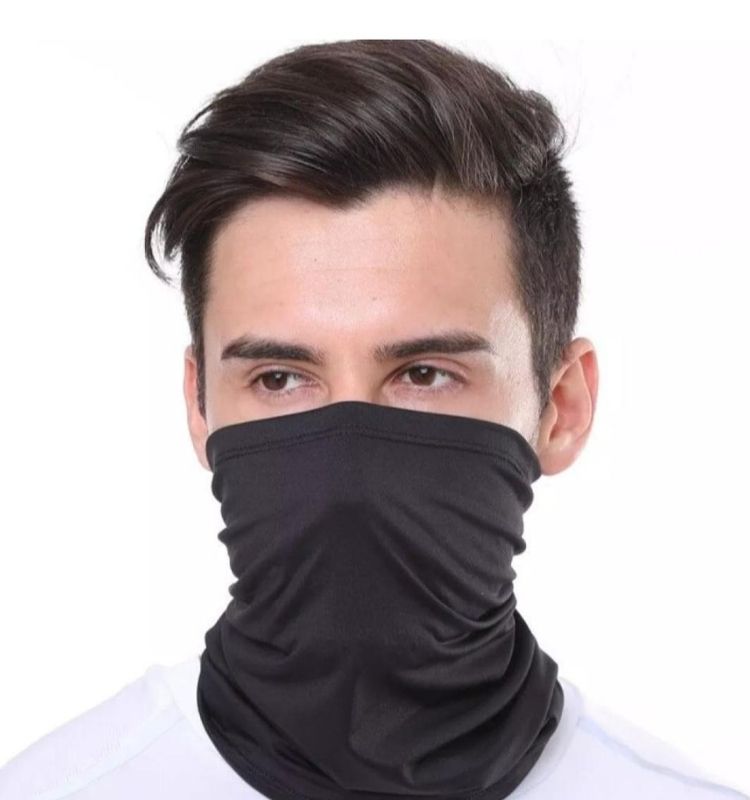 Man wearing a black balaclava gaiter neck warmer for face protection and cold weather comfort.