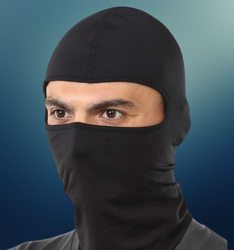 Man wearing a black full-face work balaclava mask for protection and warmth on job sites.