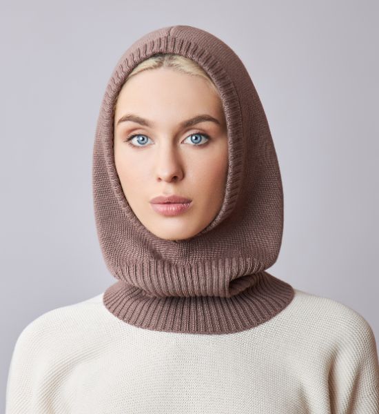 Woman wearing a soft brown balaclava hat with a ribbed neck design.