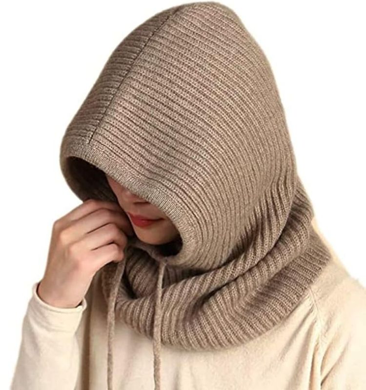Woman wearing ribbed knit balaclava head scarves & neck wraps in beige for winter warmth