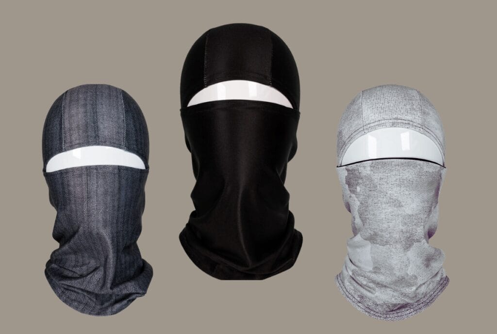 Three convertible balaclavas with hinged face panels in grey, black and printed fabric