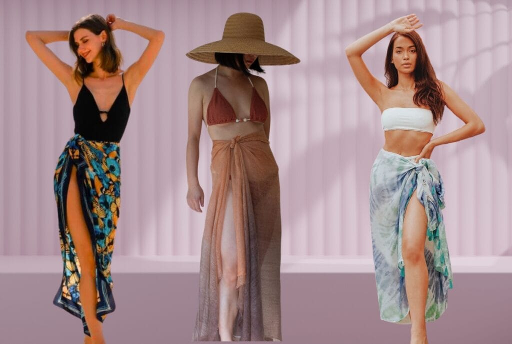 Three women wearing printed sarongs and wraps as beach cover-ups