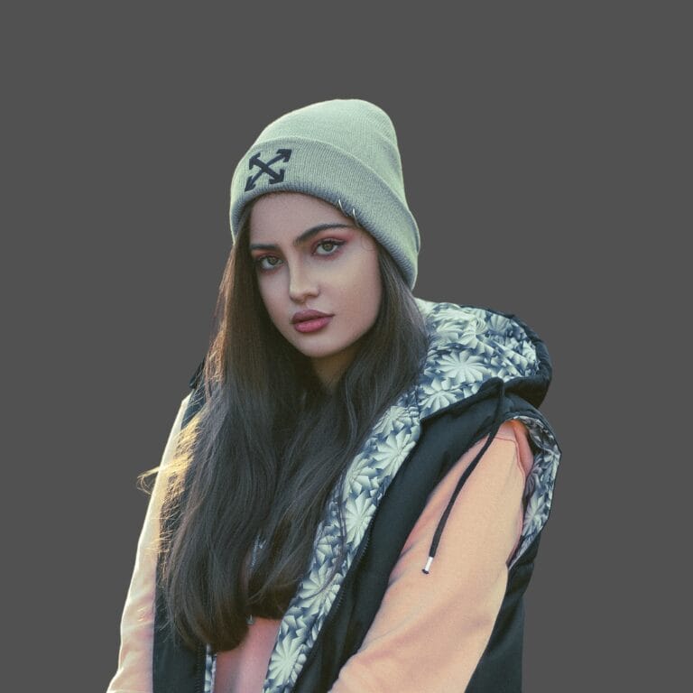 Sage green cuffed beanie with an embroidered black logo on the cuff
