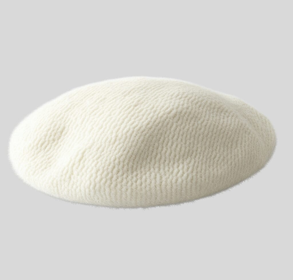 "A white textured beret cap on a light gray background, shown in a soft, rounded shape."