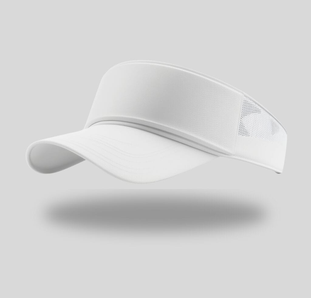 “White custom visor cap with a curved brim and perforated side panels, floating with a soft shadow on a gray background.”
