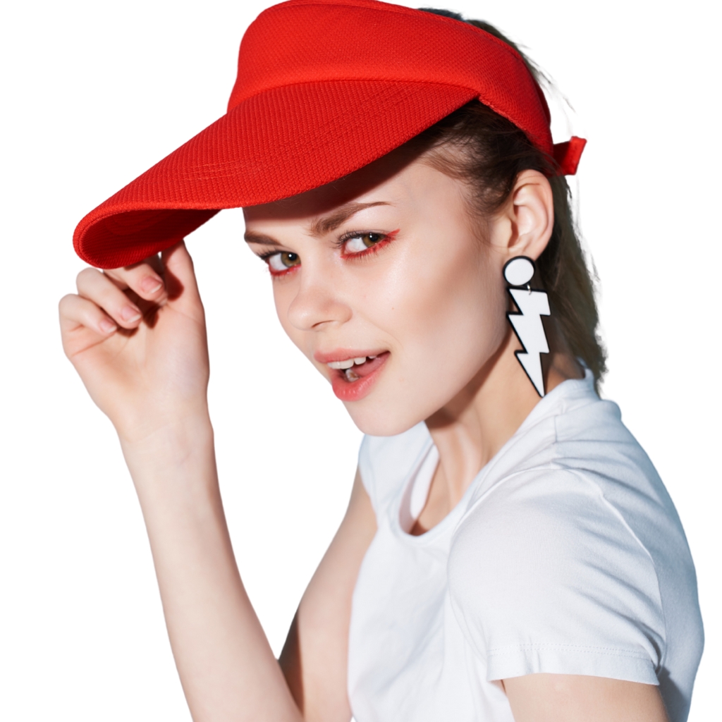 A person wearing a polyester visor cap while jogging outdoors on a sunny day.