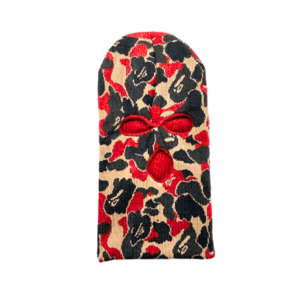 Red, black, and beige camouflage balaclava with eye and mouth openings.