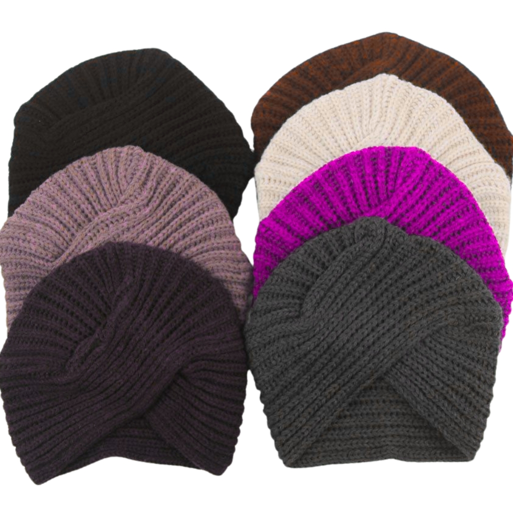 A collection of knitted turban beanies in multiple colors, overlapping in a fan-like arrangement.