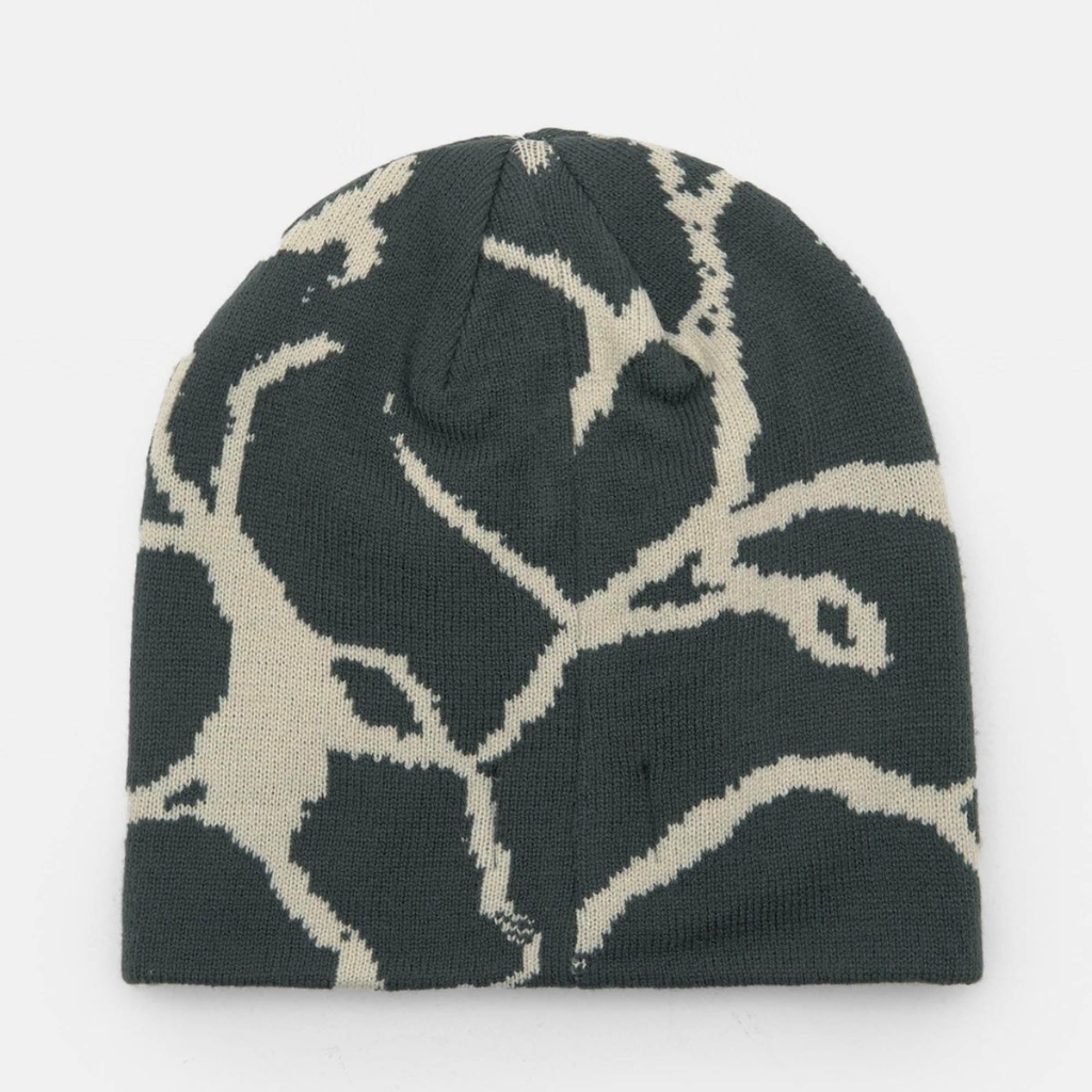 Beanie hat with a dark base and light abstract graphic pattern.