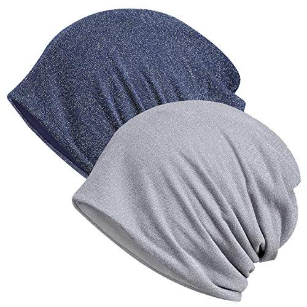Two soft, lightweight beanies in navy blue and light gray, draped to show their stretch and texture.