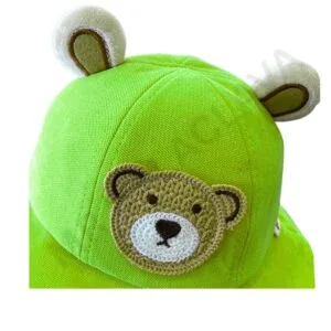 A bright green hat with plush bear ears and an embroidered teddy bear face.