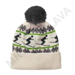 A white knitted winter hat with a black pom-pom, featuring a pattern of black skiers and green lines, and dark gray snowflakes.