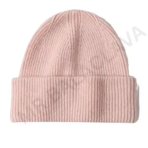 A light pink ribbed knit beanie hat on a white background.