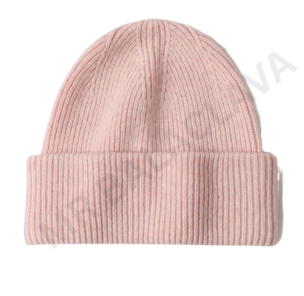 A light pink ribbed knit beanie hat on a white background.