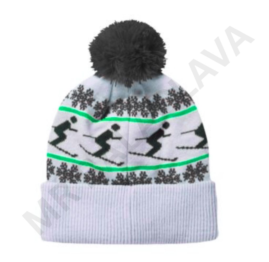 A white knitted winter hat with a black pom-pom, featuring a pattern of black skiers and green lines, and dark gray snowflakes.