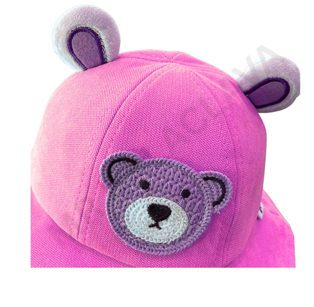 A vibrant pink hat with plush bear ears and an embroidered purple teddy bear face.