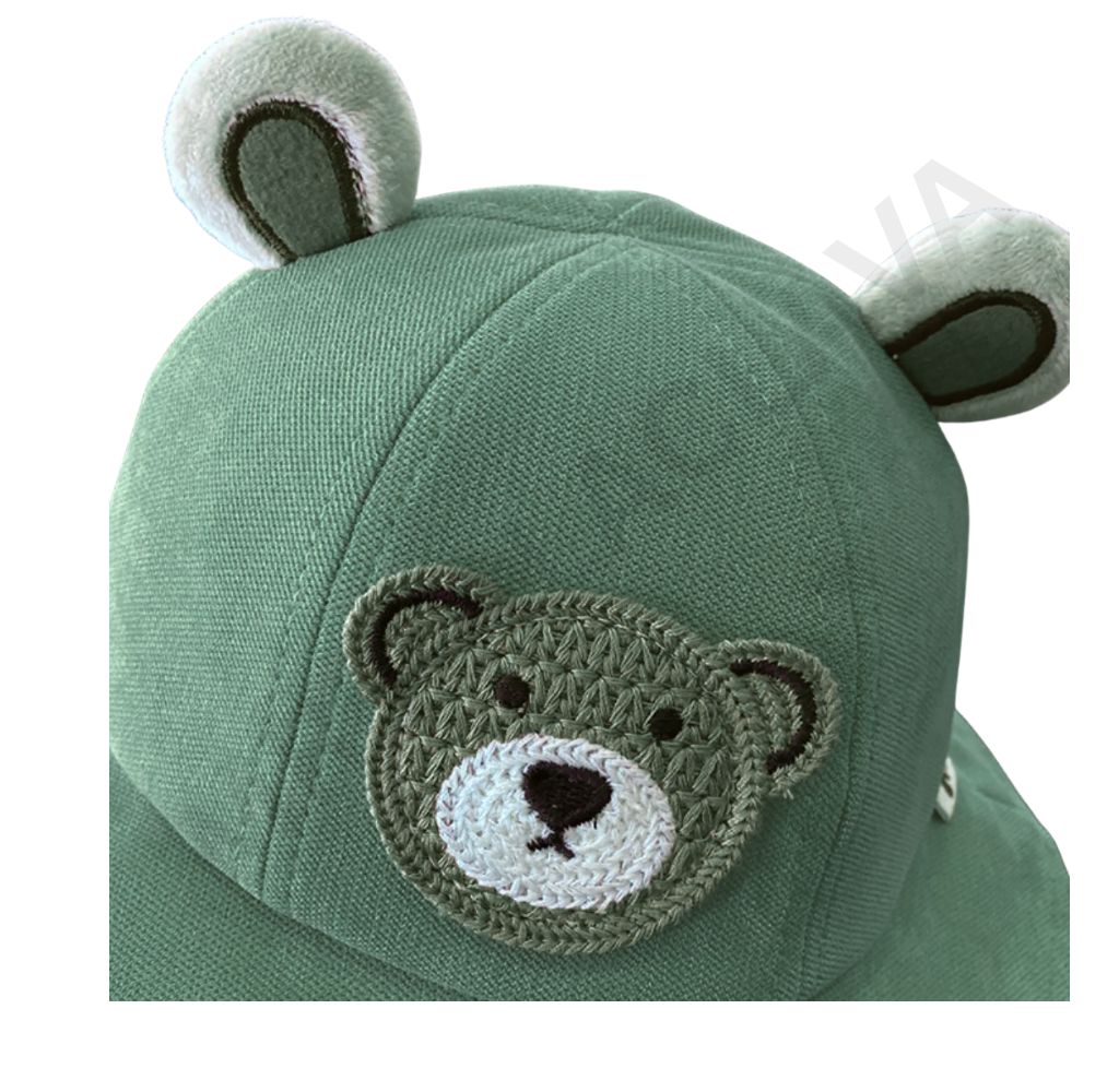 A muted green hat with plush bear ears and an embroidered grey teddy bear face.