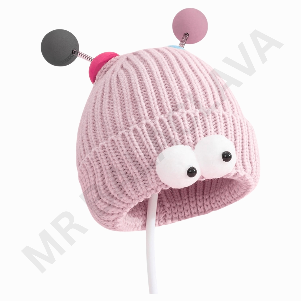 A pink knitted hat with two large white googly eyes sewn on the front and pink antennae with pink balls on top, connected by small springs.