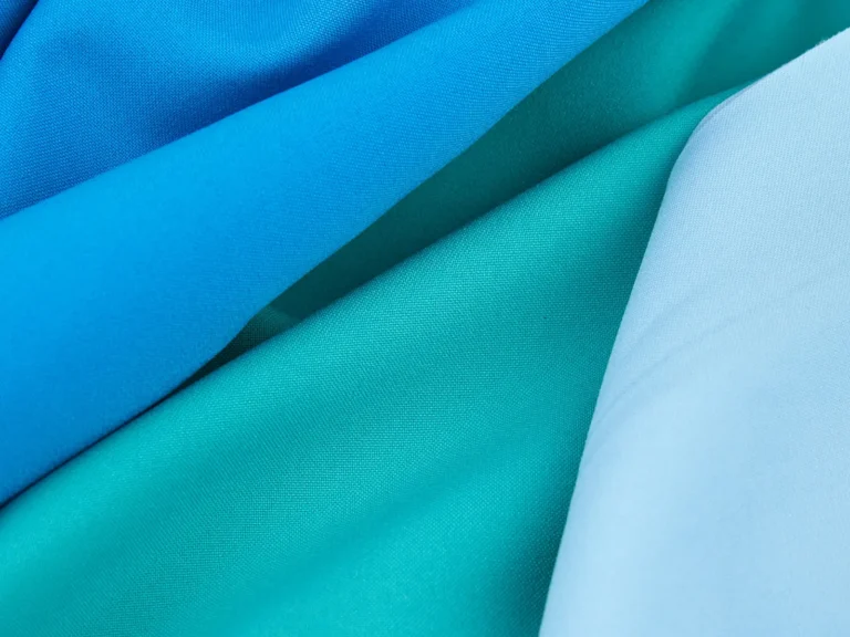 Layers of smooth blue and turquoise knit fabric