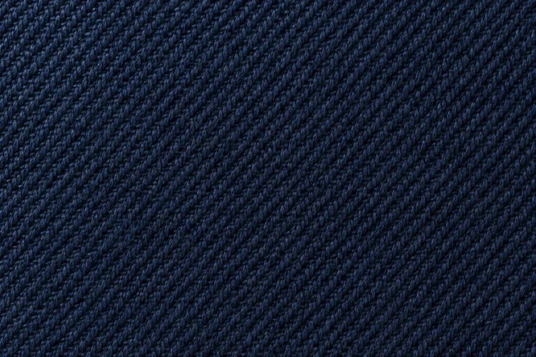 Cotton Twill (Cap Fabric): close-up of navy cotton twill with a fine diagonal rib