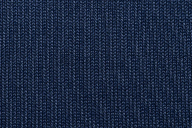 Merino Wool Blend (Nylon or Elastane): close-up of navy merino wool blend jersey with dense, even stitches