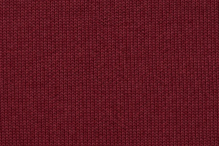 Close-up of burgundy midweight cotton jersey with fine knitted stitches