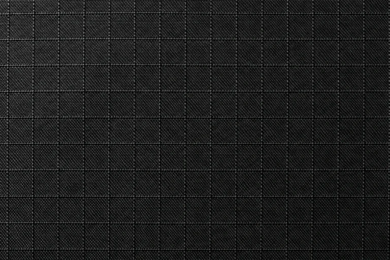Nylon & Ripstop (Cap Fabric): close-up of black nylon ripstop with a small square grid