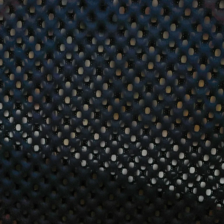 Close-up of a dark mesh fabric with small, even holes