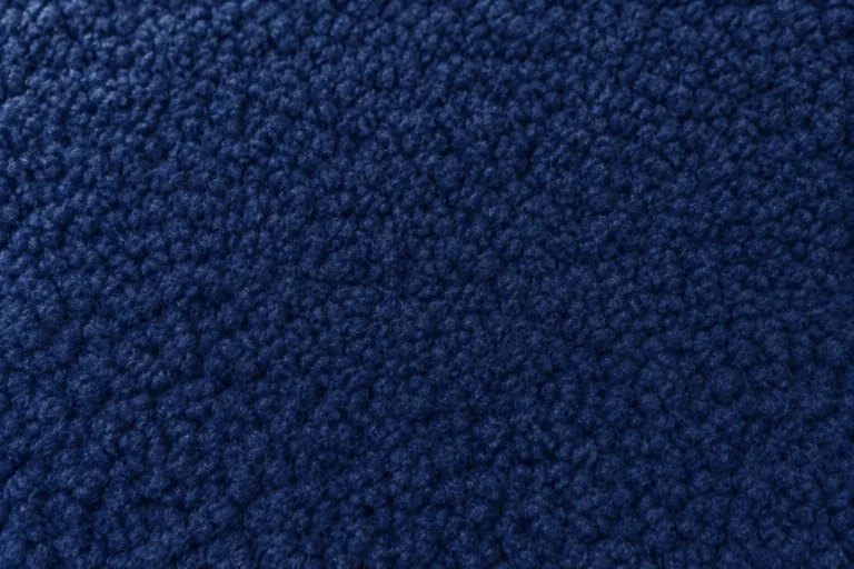 Close-up of navy polar fleece with a thick, lofty pile