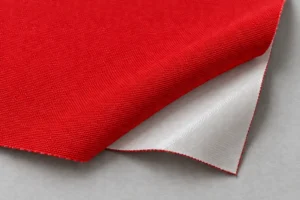 PU-Coated Waterproof Shell: red shell swatch with the white PU coating on the back at a folded corner