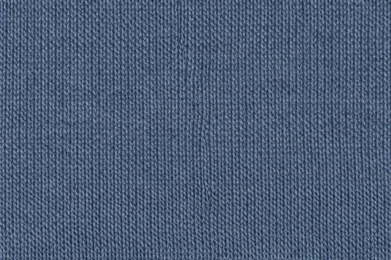 Recycled Polyester Knit (RPET): close-up of slate-blue recycled polyester jersey with fine knitted stitches