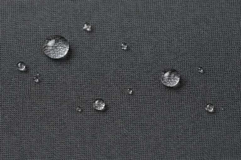Close-up of charcoal softshell face with water droplets beading