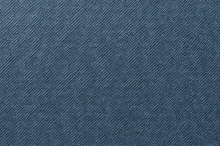 Close-up of steel-blue stretch woven shell with a fine dense weave