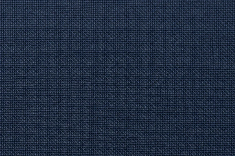 Close-up of navy 3-layer laminated shell, woven face