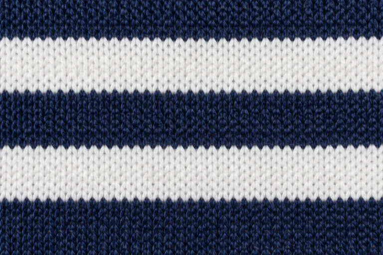 Double-Layer Acrylic Jacquard (Fan Scarf Knit): close-up of a navy and white acrylic jacquard scarf knit with block stripes