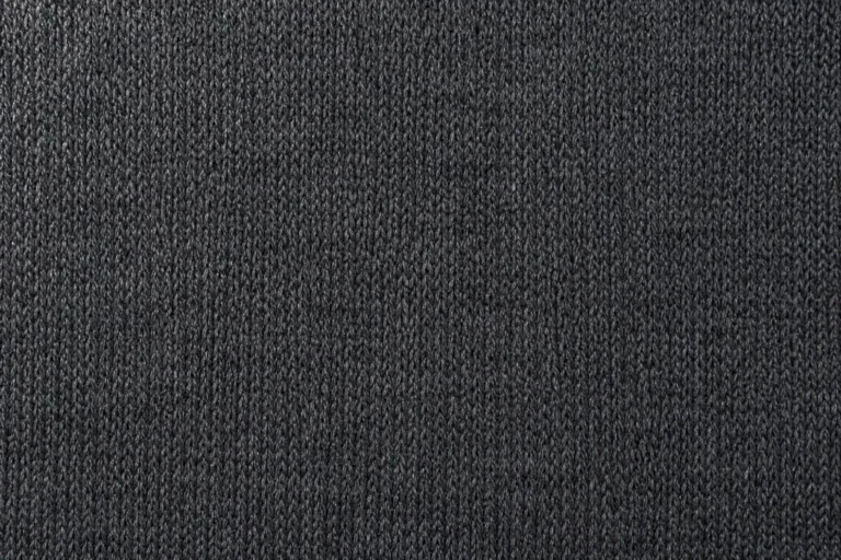 Close-up of the smooth face of charcoal brushed-back stretch fleece