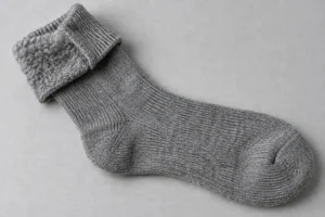 Brushed Interior Sock Knit: grey thermal sock turned partly inside out to show the brushed inside