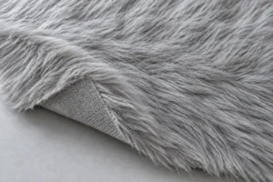 Silver-grey faux fur with the knitted back at a folded corner