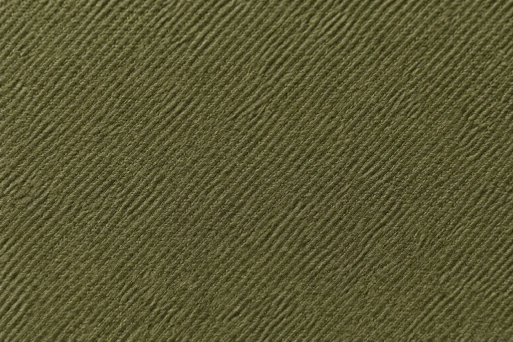 Peached Polyester Twill (Peach Skin): close-up of olive peached polyester twill with a soft matt surface