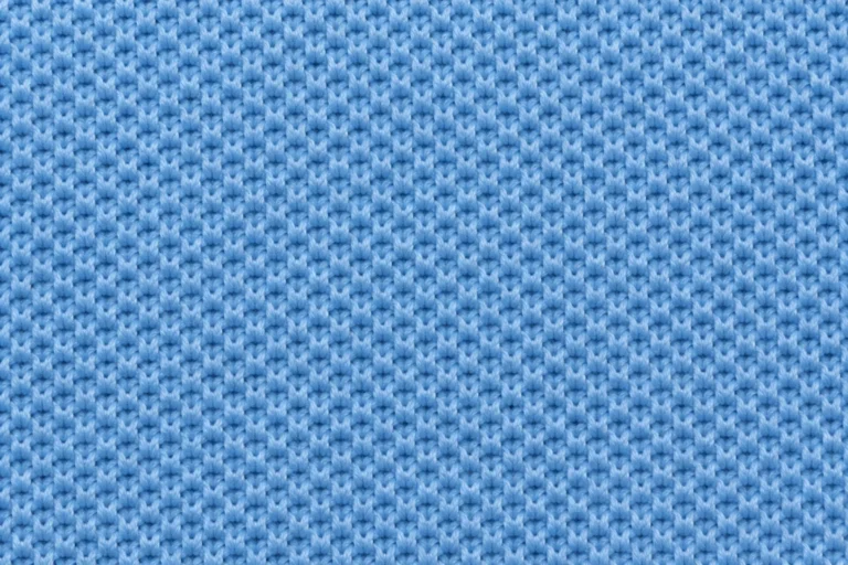 Close-up of sky-blue polyester piqué with a fine raised honeycomb texture