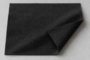 Polyester-Trikot (Kettenwirkware): schwarzes Polyester-Trikot-Muster mit sichtbarer kettengewirkter Rückseite