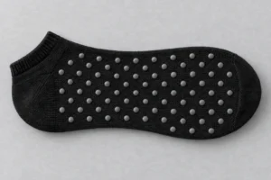 Silicone Grip Sole Print: black grip sock with silicone dots on the sole